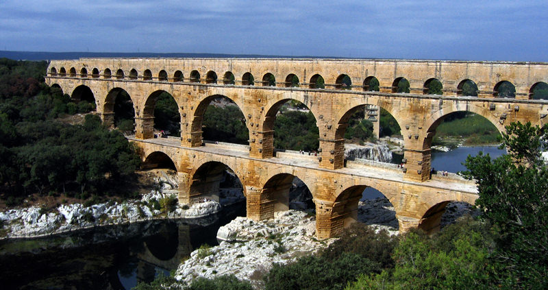 The romans knew how to move around water using gravity. Here's the aqueduct Pont du Gard from around 40AD.